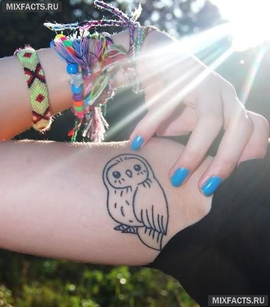 татуировки на бицепсе в виде совы