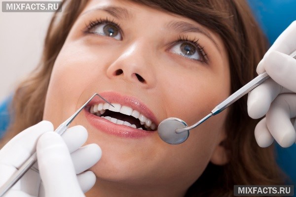 Почему после пломбирования каналов болит зуб? 