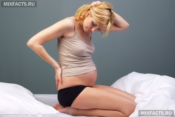 Почему тянет живот при ранней беременности?  